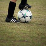 person playing soccer on field