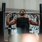 man lifting barbell