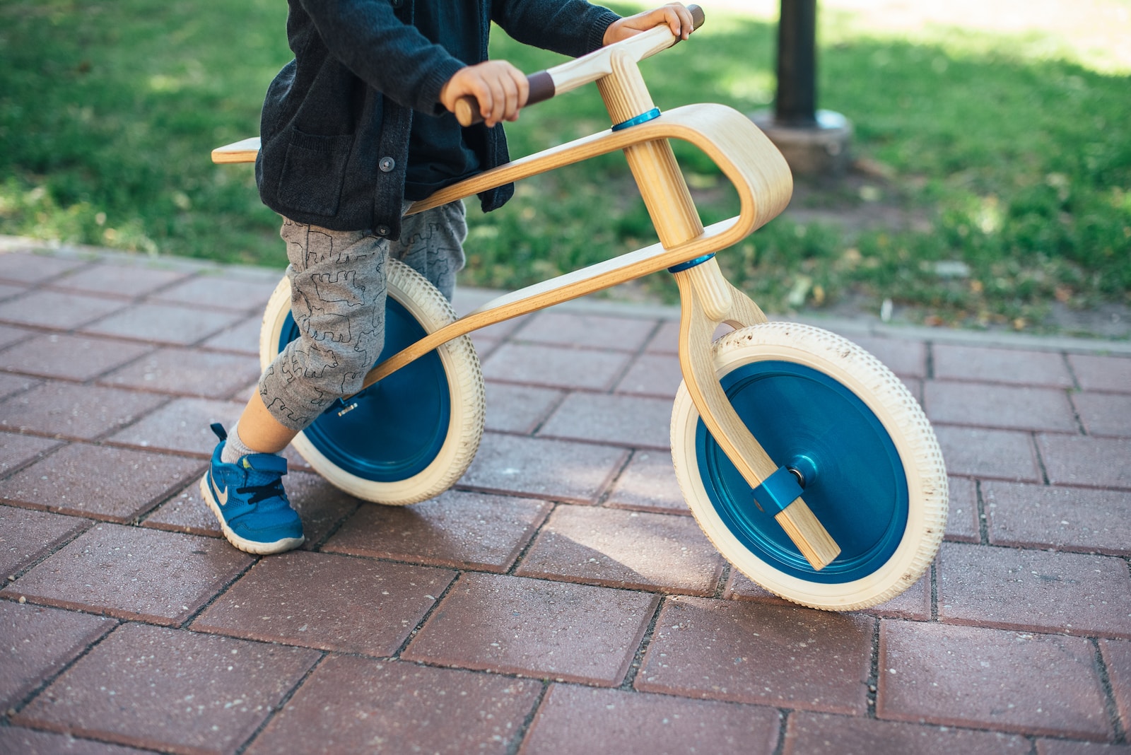 toddler riding balance bike