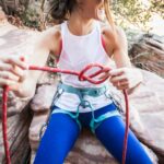 woman holding red rope